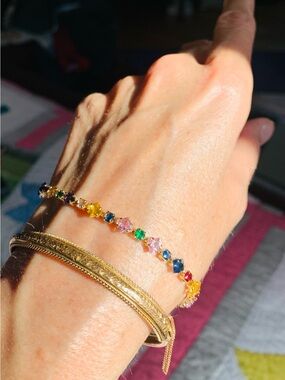 New Unworn multicoloured crystal bracelet, gold plate.